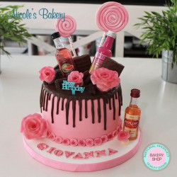 Drip Cake with mini alcohol bottles and chocolate roses